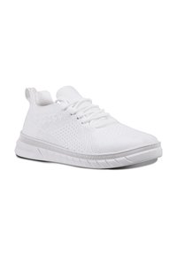 White athletic shoes featuring a textured knit upper, lace-up design, and contrasting outsole pattern for traction and flexibility.