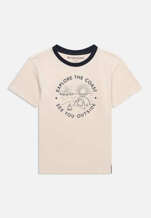 Children's beige t-shirt with black collar, featuring a campsite print including a tent, campfire, sun, ocean, and the text "Explore the coast, see you outside."