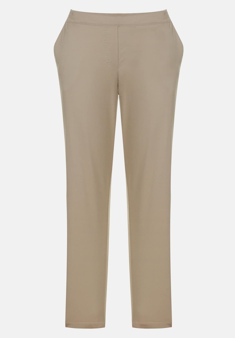Beige Hosen mit geradem Bein, elastischem Bund und weichem, glattem Stoff. Keine sichtbaren Taschen oder Verzierungen.