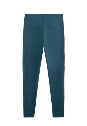 Legíny v tyrkysovej farbe s priliehavým strihom, zdobené zakrivenými švovými detailmi a hladkou textúrou. Pás je elastický pre bezpečné a pohodlné uchytenie.