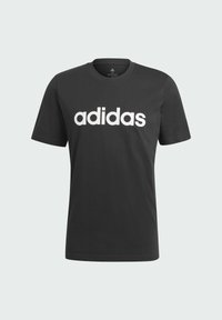 Musta puuvillapaita, jossa on rohkea valkoinen "adidas"-logo edessä. Standardi pyöreä kaula-aukko ja lyhyet hihat, sekä sileä pinta.