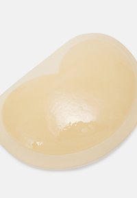 Gel eye mask in a kidney shape, featuring a smooth, translucent golden surface and a soft beige outer edge.