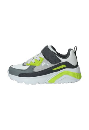 Witte, grijze en neon groene kindersneaker met klittenbandsluiting, veters, gevoerde zool en Skechers-logo aan de zijkant.