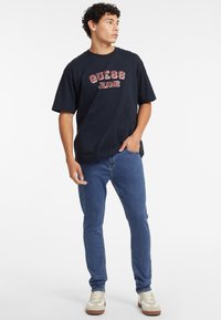 Guess Jeans VINTAGE - Marškinėliai su spaudiniu - schwarz