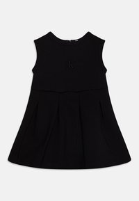 Černé bezrukávové šaty s kulatým výst�řihem, pliseovanou sukní a jemně embosovaným logem na hrudi. Vyrobeno z měkké, elastické látky.