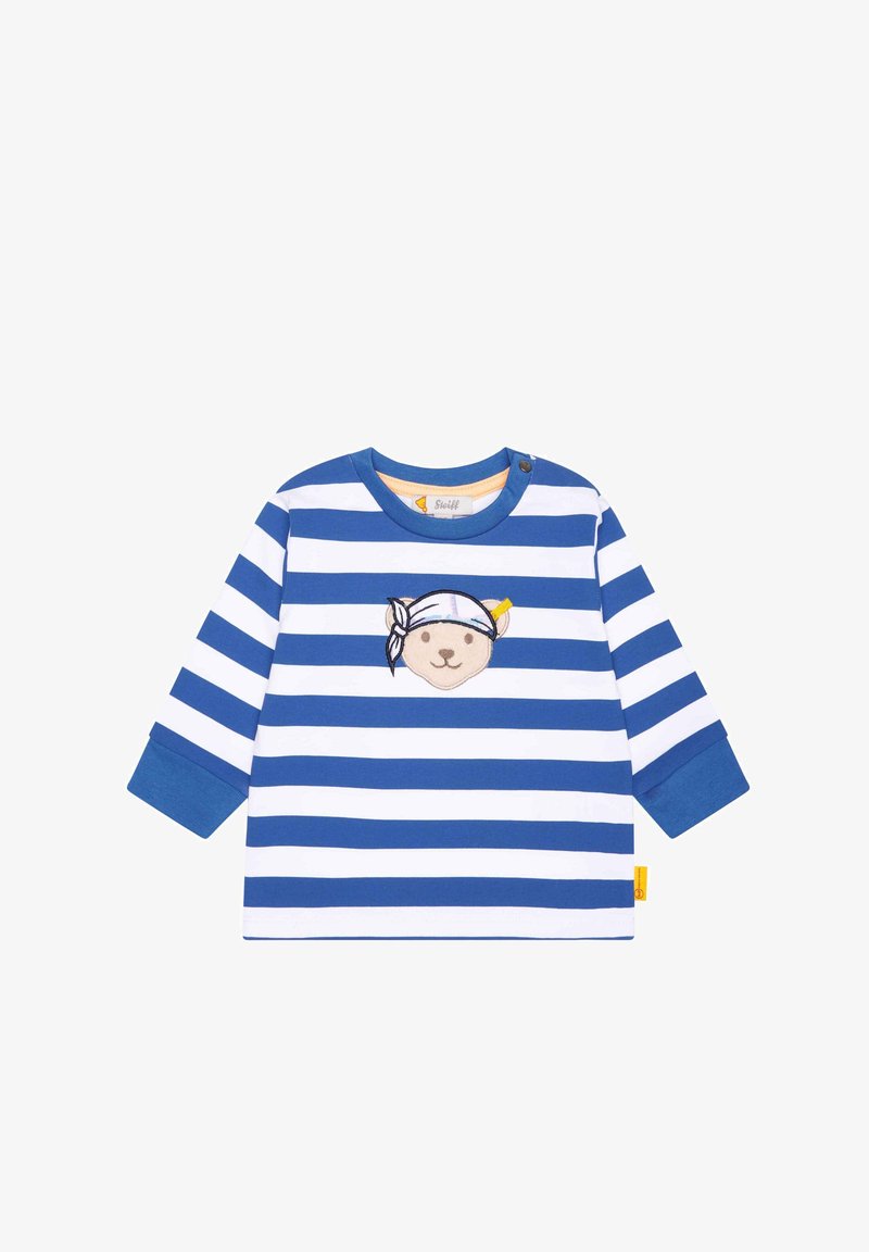 Camisa de rayas azul y blanca de manga larga con bordado de cara de oso usando un pañuelo. Hecha de algodón, con cuello redondo y cierre a presión.