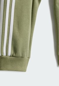 adidas Performance BADGE OF SPORT - Tuta - beige white