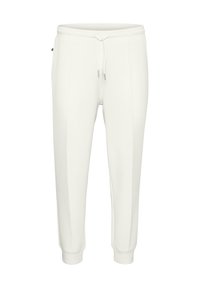 Hvide sweatpants lavet af blødt stof, med en elastisk talje med snoretræk, tætsiddende pasform og sidepaneler.