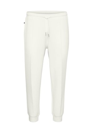 White sweatpants made of soft fabric, featuring an elastic waistband with a drawstring, tapered fit, and side seam accents.