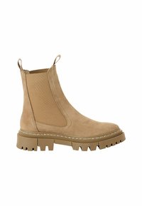 Beige velúr bokacipő, elasztikus oldalsó panelekkel, húzófülekkel és vastag gumitalppal, amely mély barázdákkal rendelkezik a tapadás érdekében.