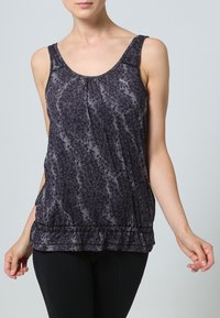 Svart linne med geometriskt mönster, utan ärmar, samlad nederkant och en mjuk textur, lämplig för vardagsbruk.