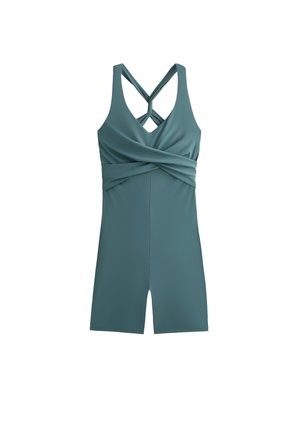 Sleevetön teal-coloured haalari, jossa on ristikkäiset hihnat, kerrostettu etupinta ja tiukka muotoilu. Sileä kangas, jossa on pehmeä rakenne.