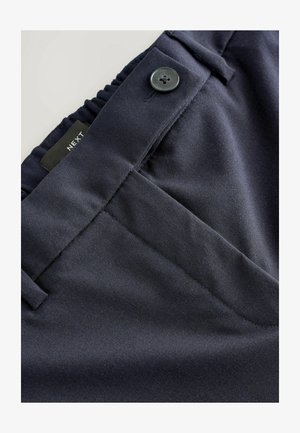 Marinblå byxor med en slät tygkonstruktion, rakt fram med knappstängning, elastisk midja och välformad sömnad.