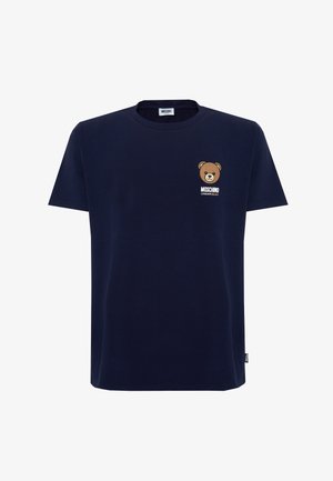 T-shirt bleu marine à manches courtes avec un petit motif d'ourson et le texte « Moschino Underbear » sur le haut gauche de la poitrine.