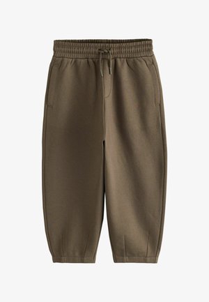 Brune elastiske joggebukser med snøre i taljen, sidelommer og tilspidsede elastiske manchetter.