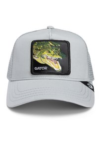 Cappello grigio con una parte frontale strutturata, dotato di una toppa rettangolare nera con un alligatore e la scritta "GATOR" in bianco. Fascia posteriore regolabile.