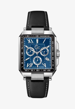 Ruudukujuline roostevabast terasest käekell sinise kellanäidikuga, hõbedased alkkellanäidikud, tahhümeetriline skaala ja must nahkrihm valgete õmblustega.