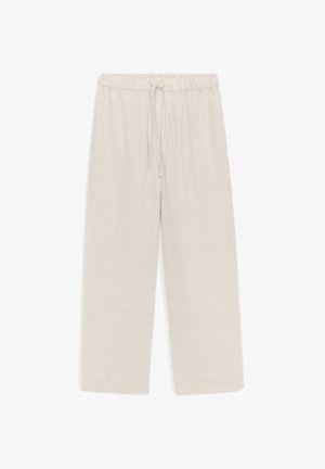 Pantalon ample beige clair à taille élastique avec cordon, en tissu texturé, présenté sur un fond blanc.