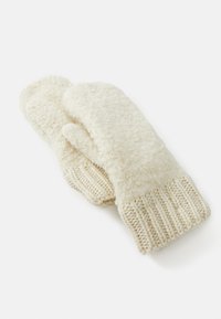 Moufles couleur crème fabriquées en tissu doux et texturé avec un poignet tricoté. Possède un extérieur lisse et un intérieur duveteux pour la chaleur.
