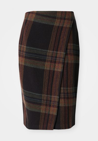 Tartan pencil skirt in dark colors with horizontal and vertical patterns. Made of wool, featuring a side slit for ease of movement.