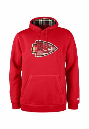 Felpa rossa con tasca frontale, caratterizzata da un logo dei Kansas City Chiefs in nero e giallo. All'interno del cappuccio presenta un motivo a quadri.