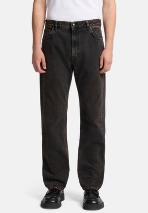 Black denim jeans with a straight-leg fit, featuring a button closure, five pockets, and minimal fading. Paired with black shoes.
