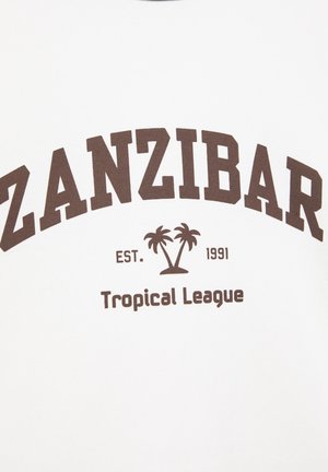Text ZANZIBAR s dvoma palmami medzi "EST." a "1991," nad "Tropical League" na bielom plátne, naznačujúci tropickú tému.