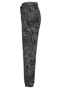 Zwarte sweatpants met een witte geometrische print en een elastische tailleband met trekkoord. Getailleerd ontwerp met een taps toelopende pijp en manchet bij de enkels.