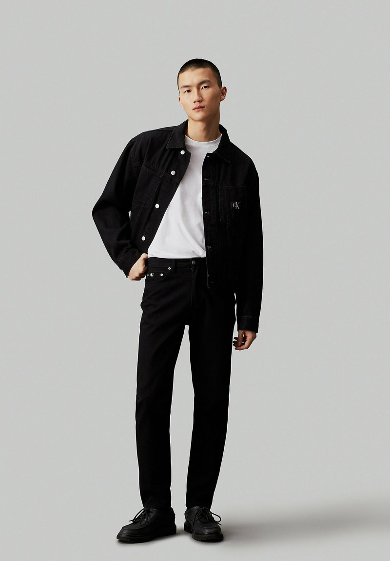 Calvin Klein Jeans Jeans Tapered Fit zwart denim/blackdenim Calvin Klein Jeans Jeans Tapered Fit zwart denim/blackdenim