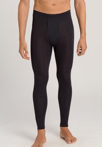 Termiske leggings i mørkegrå, lavet af blødt, strækbart stof. Har et tætsiddende design med en elastisk talje og forstærkede syninger.