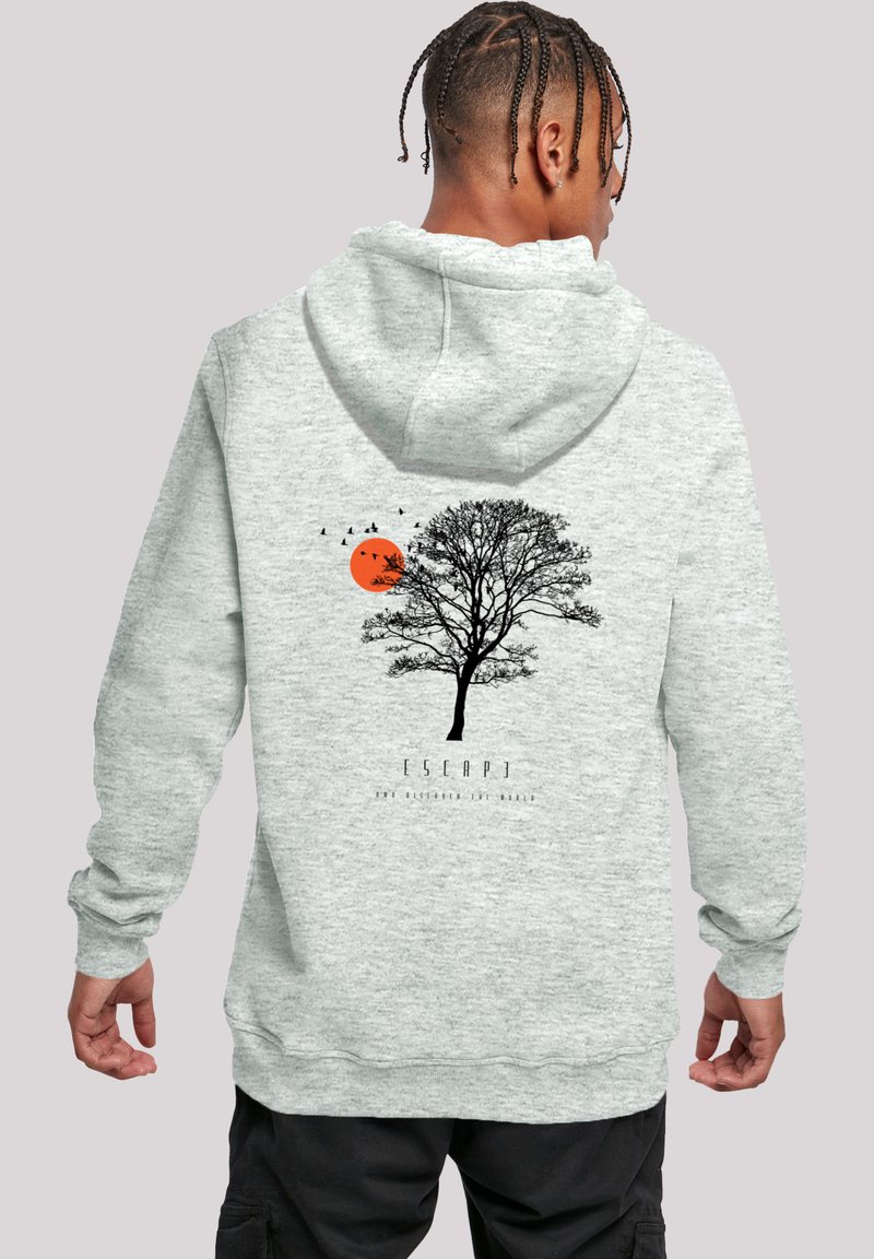Gray hoodie featuring a black tree graphic, an orange sun, and birds. Texture is smooth with a relaxed fit design. Text reads "ESCAPE."