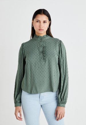 Green blouse with a high ruffled collar, textured fabric featuring small dots, button closure, and long sleeves with elastic cuffs.