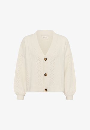 Gilet tricoté crémeux avec un col en V, des poignets côtelés et cinq grands boutons marron. Présente un motif texturé en zigzag sur l'ensemble.