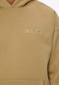 Beige hoodie made of soft cotton blend, featuring a kangaroo pocket and embroidered "Dropsize" logo in a stylized font on the chest.