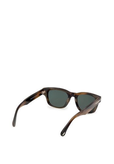 Tortoiseshell rectangular sunglasses with dark green lenses resting open on a white surface.