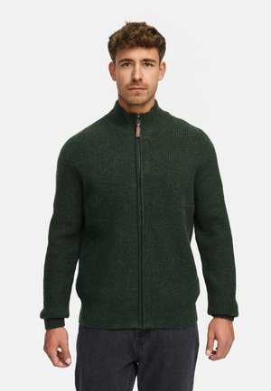 Mørkegrøn zip-up sweater lavet af ribbet stof, med en opretstående krave og lynlås foran.
