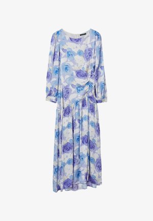 Floral maxi dress featuring blue and purple rose patterns on a white background, long sleeves, gathered waist, and tiered skirt.