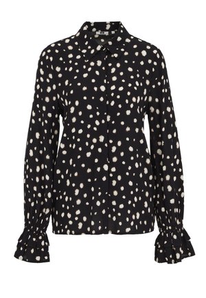 Fekete blúz fehér pöttyös mintával. Galléros nyakkivágással és fodros mandzsettákkal a hosszú ujjain.