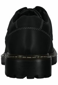 Scarpe in pelle nera con punta arrotondata, cuciture a contrasto, suola spessa nera e texture rigata. Progettate per durevolezza e comfort.