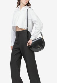 Miriade Borsa a mano - nero