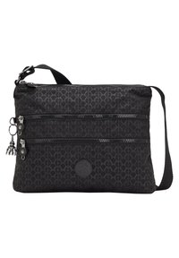 Black crossbody bag made from textured fabric featuring two zipped compartments, a metal charm, and a circular logo patch on the front.