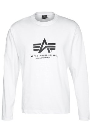 T-shirt bianco a maniche lunghe realizzato in cotone, con un logo nero con ali e testo posizionato centralmente sulla parte anteriore.