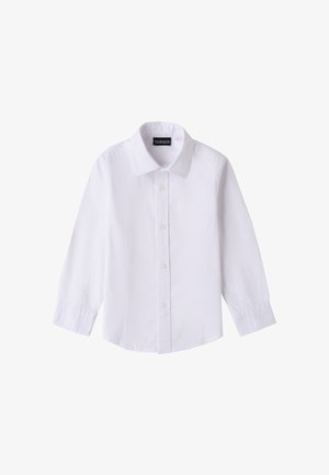 Camicia bianca a maniche lunghe con colletto classico e cuciture aderenti, mostrata distesa su uno sfondo bianco.