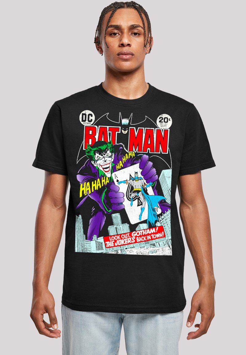 Black cotton t-shirt featuring a colorful comic print of the Joker and Batman, with text and graphics in red, green, and purple.