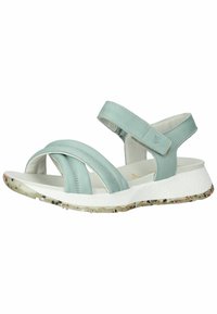 Sandali in pelle azzurro chiaro con design a fascia incrociata, cinturino alla caviglia regolabile, suola bianca con accenti texture a macchie.