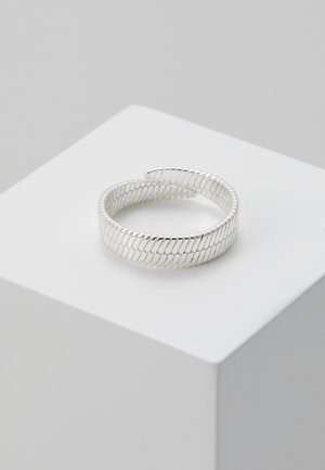 Silver cuff bracelet with a twisted wire design, featuring an open front and smooth, reflective surface.