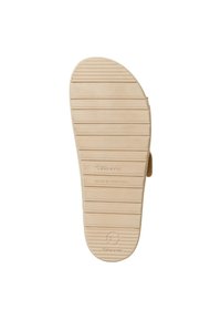 Semelle en caoutchouc beige avec des rainures horizontales, portant la mention "37" et "fabriqué au Portugal", avec un logo circulaire et une finition lisse et texturée.