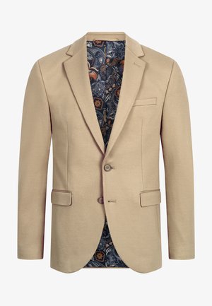 Beige men's blazer with two buttons, flap pockets, and paisley-patterned navy lining with orange and white floral designs.