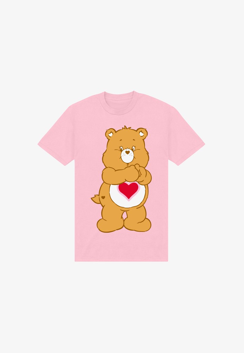 T-shirt rose clair avec un ours en dessin animé ayant un cœur sur le ventre, fabriqué en coton avec un col rond et des manches courtes.