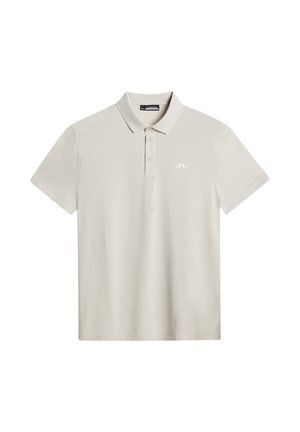 Ljusgrå pikétröja med kort ärm, en klassisk krage och knäppning med tre knappar. Har en diskret vit logotyp på vänster bröst.